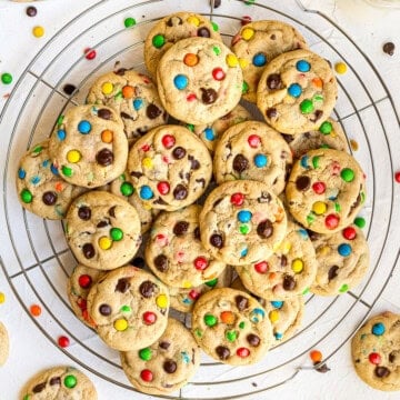 Overhead of finished cookies on round wire rack stacked square image