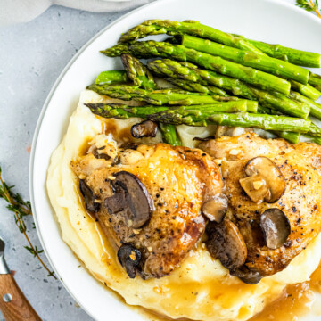 Overhead photos of Marsala Chicken Thighs over potatoes with asparagus