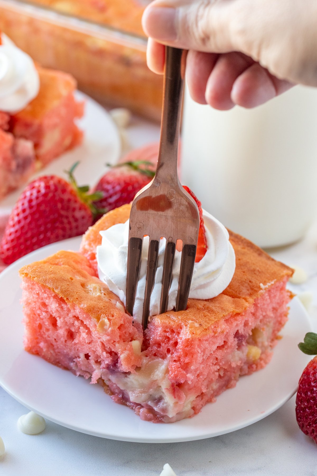 Fork going into slice of Strawberry Earthquake Cake