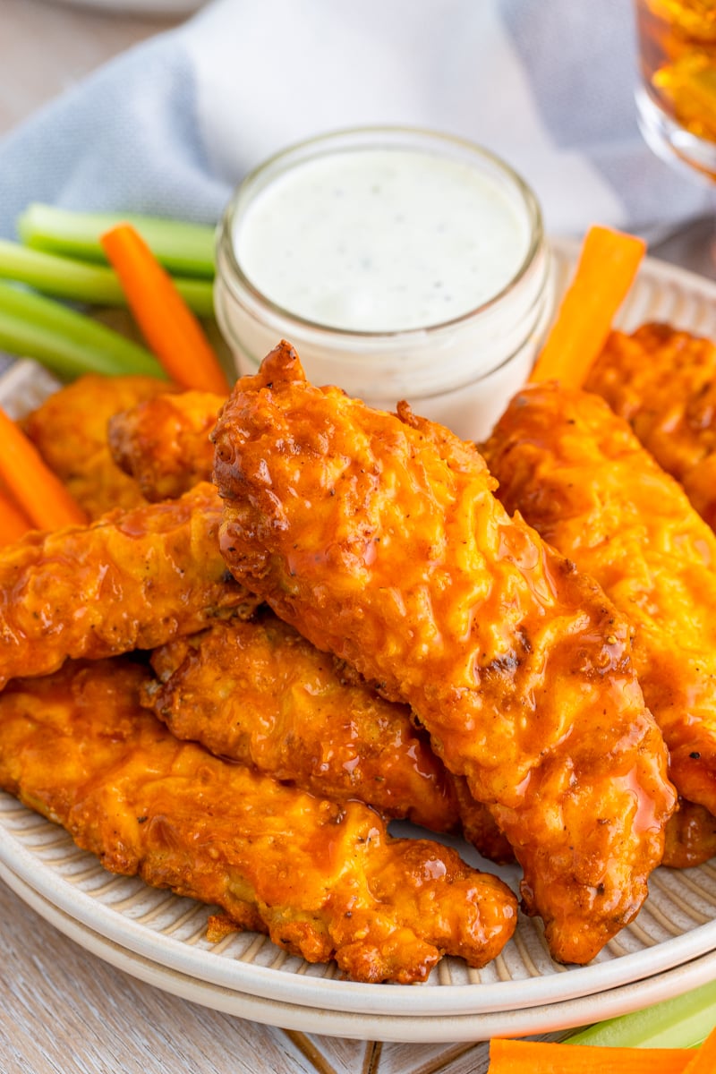 Buffalo Chicken Tenders on plate with ranch and vegetables