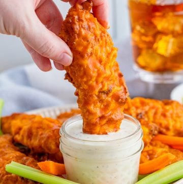 One Air Fryer Buffalo Chicken Tender dipped in ranch