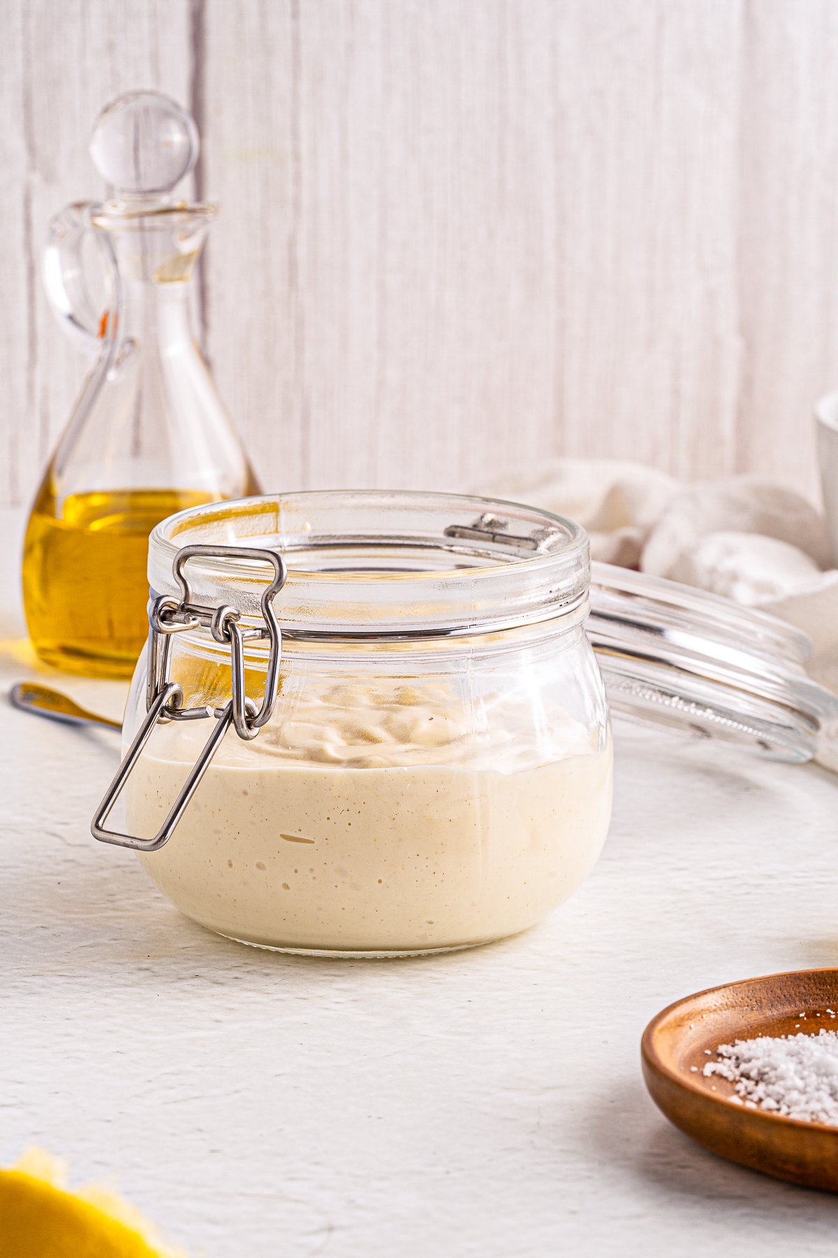 Side of jar filled with Homemade Mayonnaise