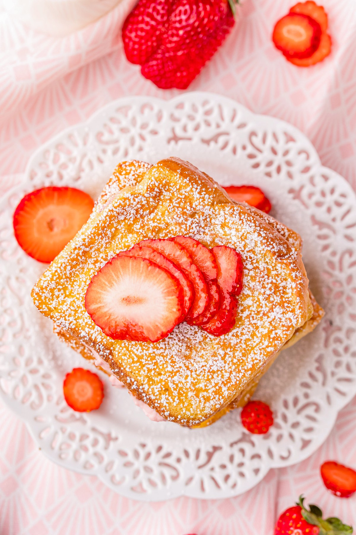 Overhead of French Toast on plate garnished with strawberries