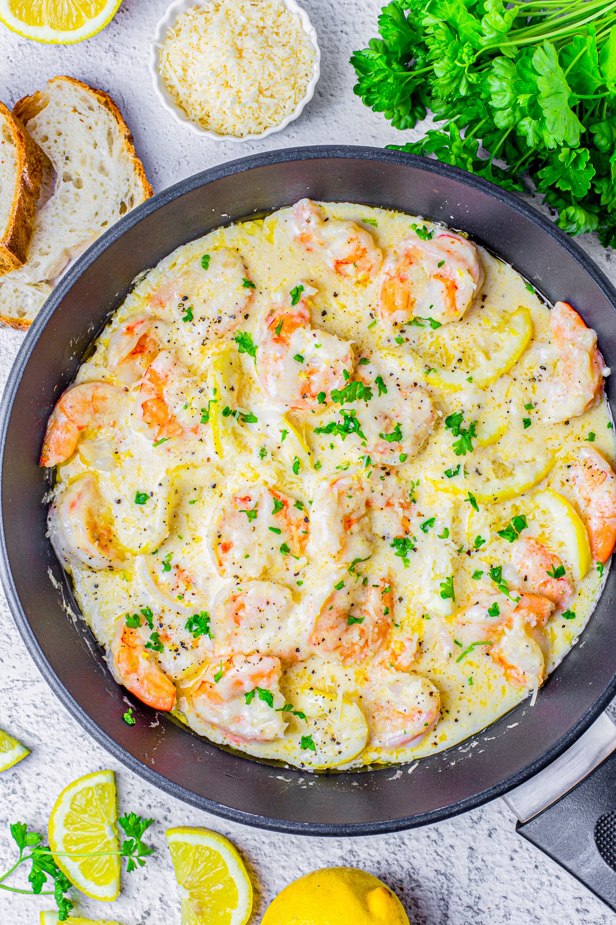 Overhead of finished Lemon Shrimp in skillet topped with parsley