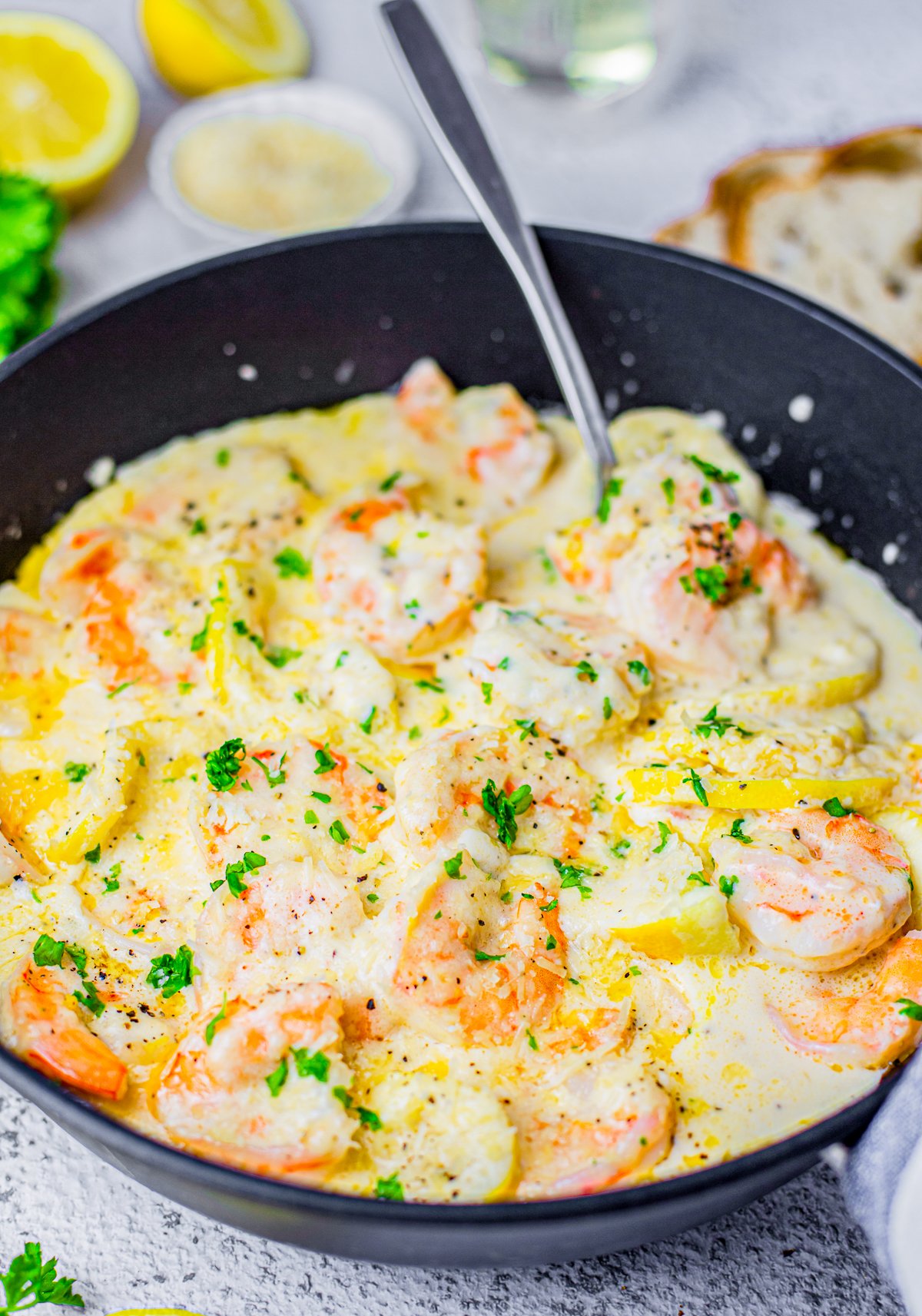 Pan with Creamy Lemon Shrimp with serving spoon inside