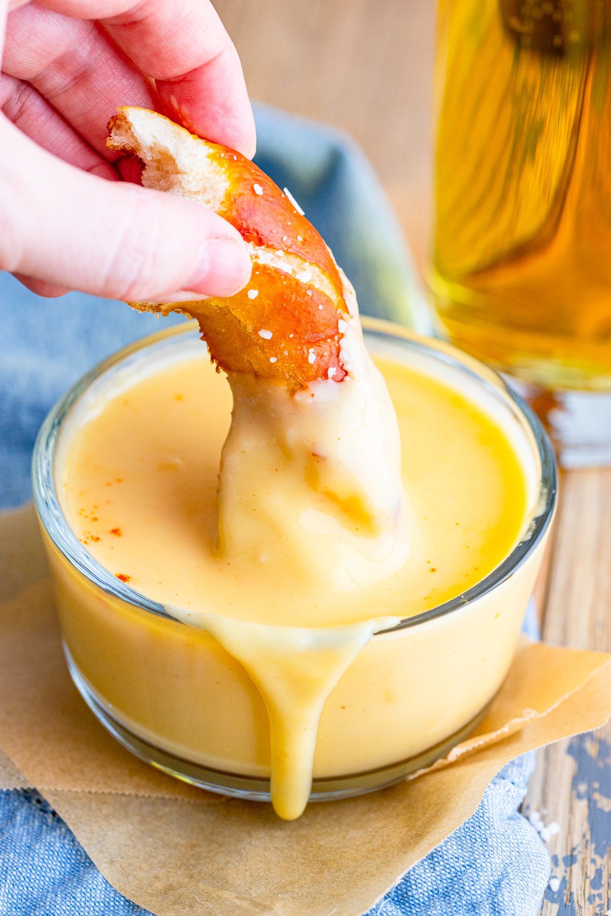 Pretzel pies being dipped into Beer Cheese Dip