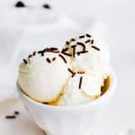 Ice cream in white bowl with chocolate sprinkles