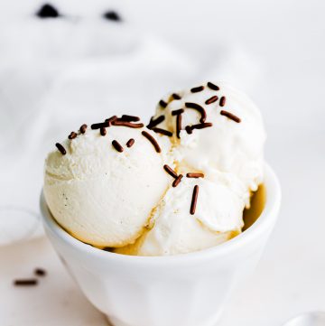 Ice cream in white bowl with chocolate sprinkles