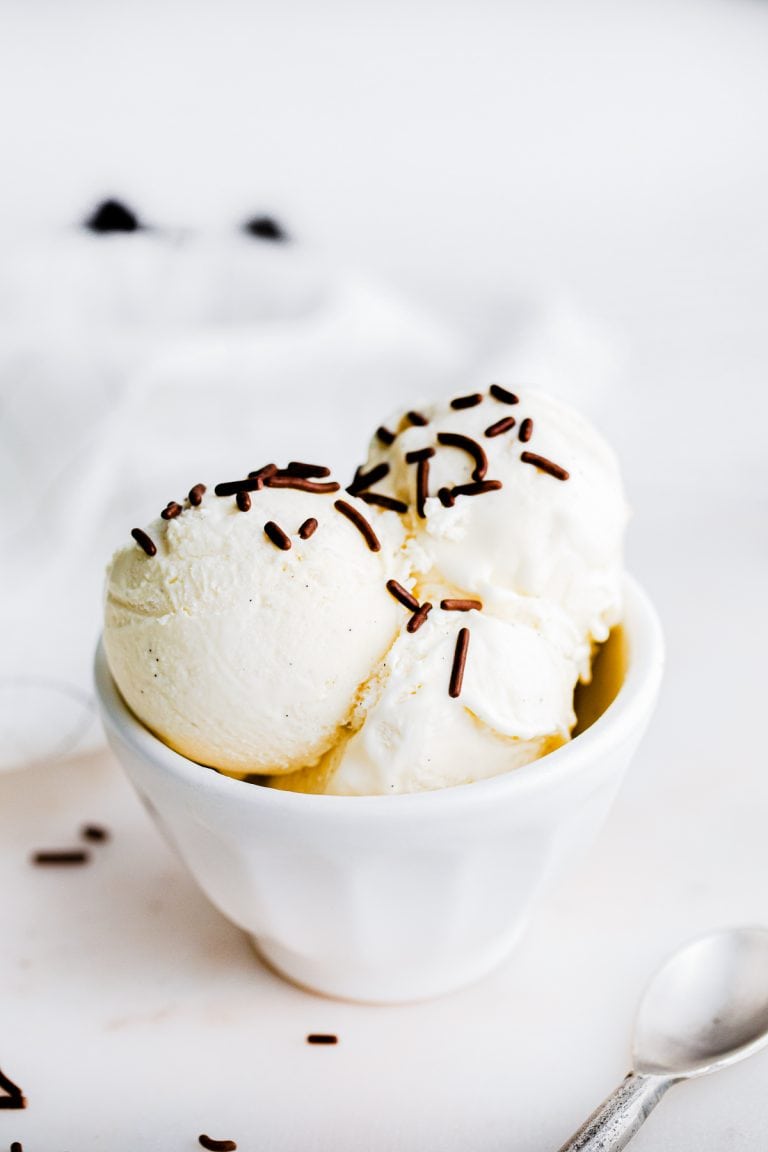 Ice cream in white bowl with chocolate sprinkles