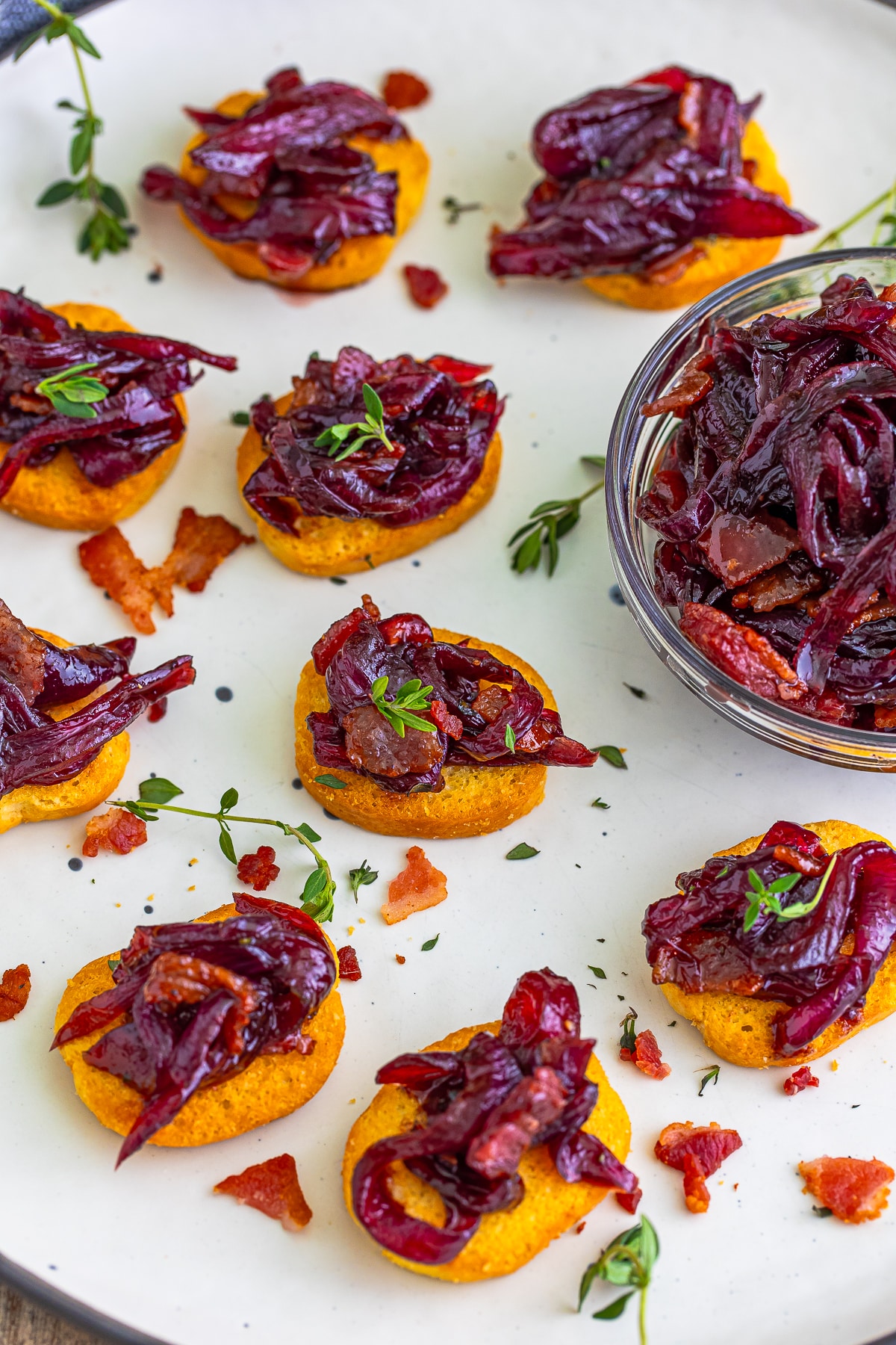 mini toasts with Onion Marmalade on top on a serving platter