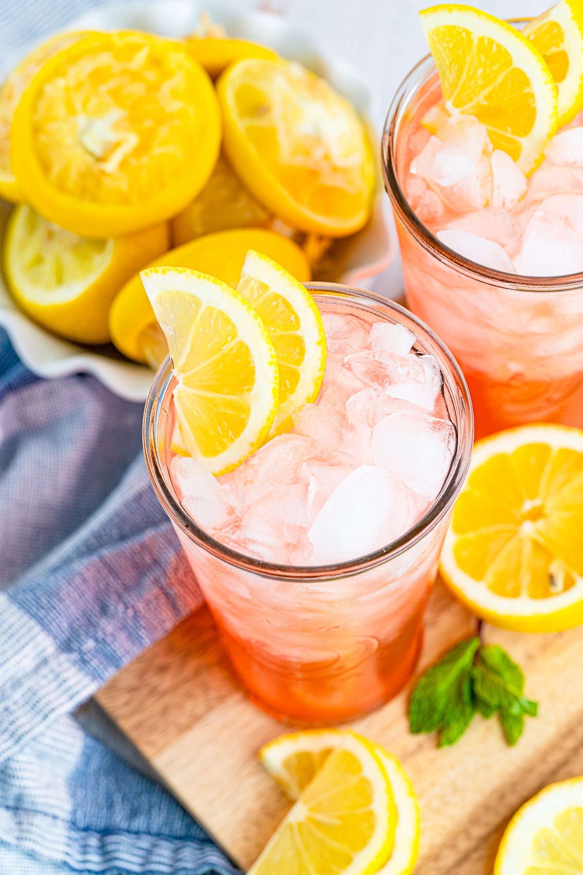 Overhead of one glass of Pink Lemonade showing the ice and lemon
