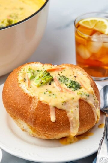 Copycat Panera broccoli cheddar soup served in a sourdough bread bowl.