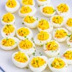 White platter full of finished Easy Deviled Eggs