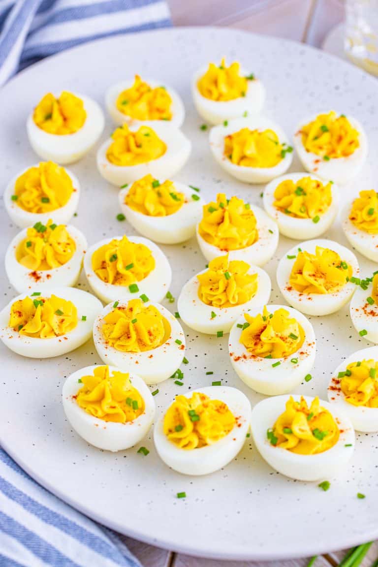 White platter full of finished Easy Deviled Eggs