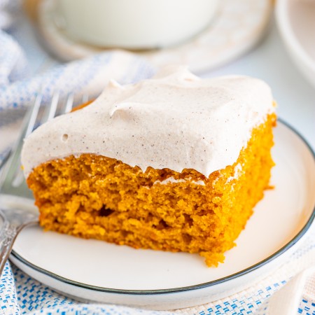 Square photo of one Pumpkin Bar on white plate frosted.