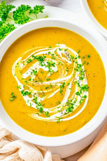 Square photo overhead of garnished Butternut Squash Soup.