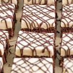 Cut Peanut Butter Brownies on parchment paper.