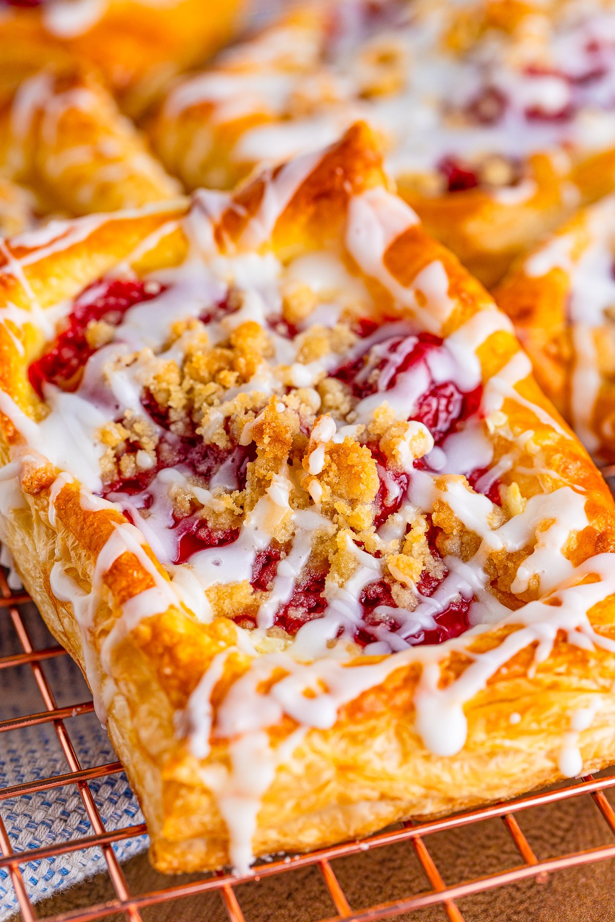 Close up of one Cherry Danish showing filling and topping.