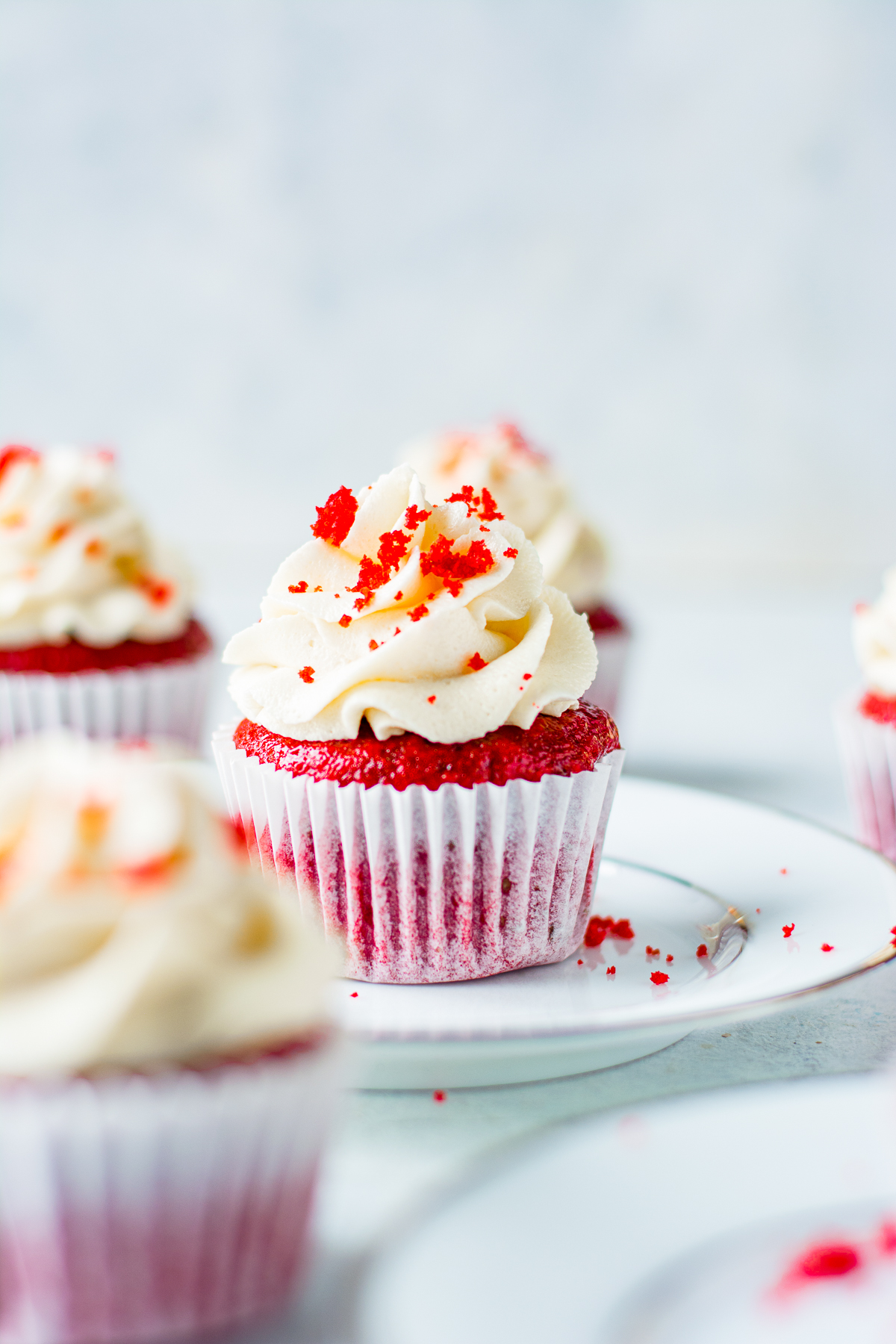 Red Velvet Cupcake Recipe on white plate decorated.