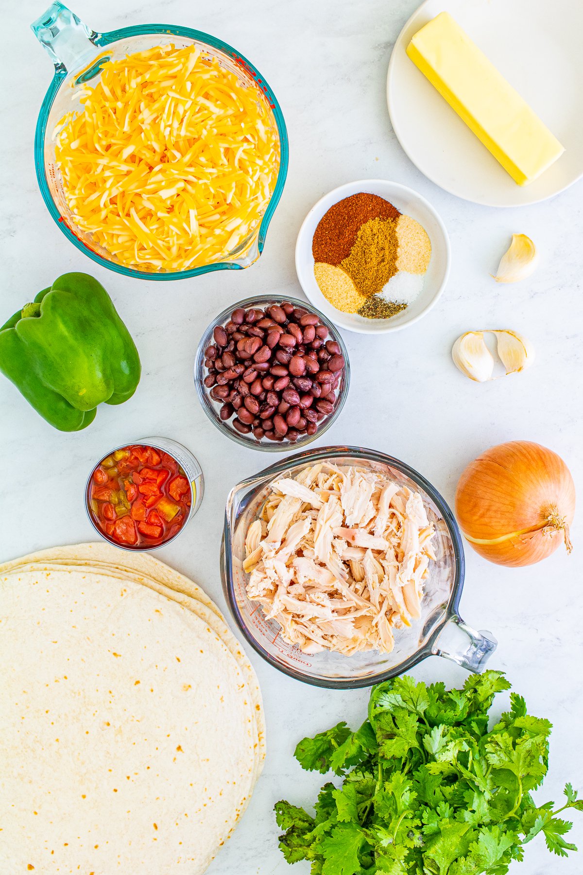 Ingredients needed to make a Chicken Quesadilla.