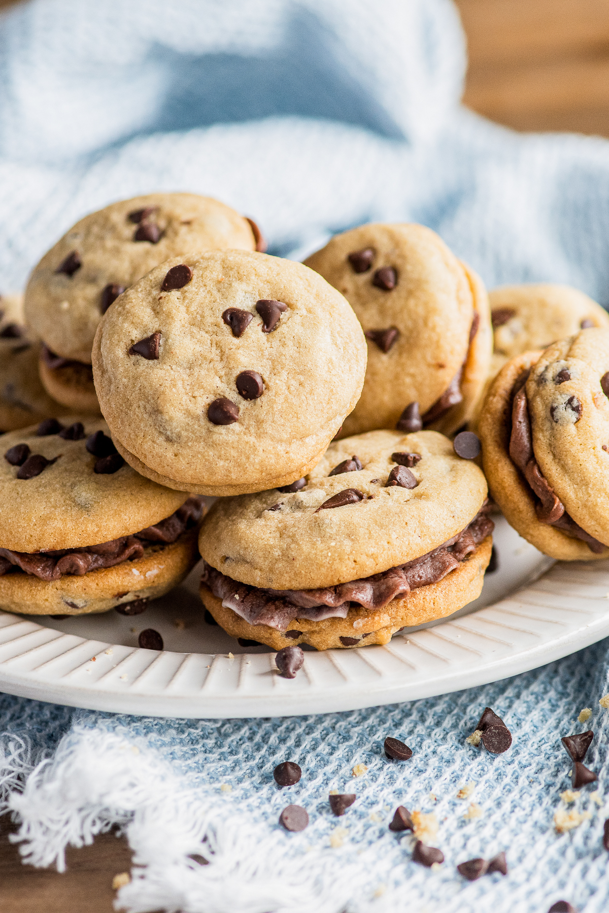 Stacked Chocolate Chip Sandwich Cookies on plate.