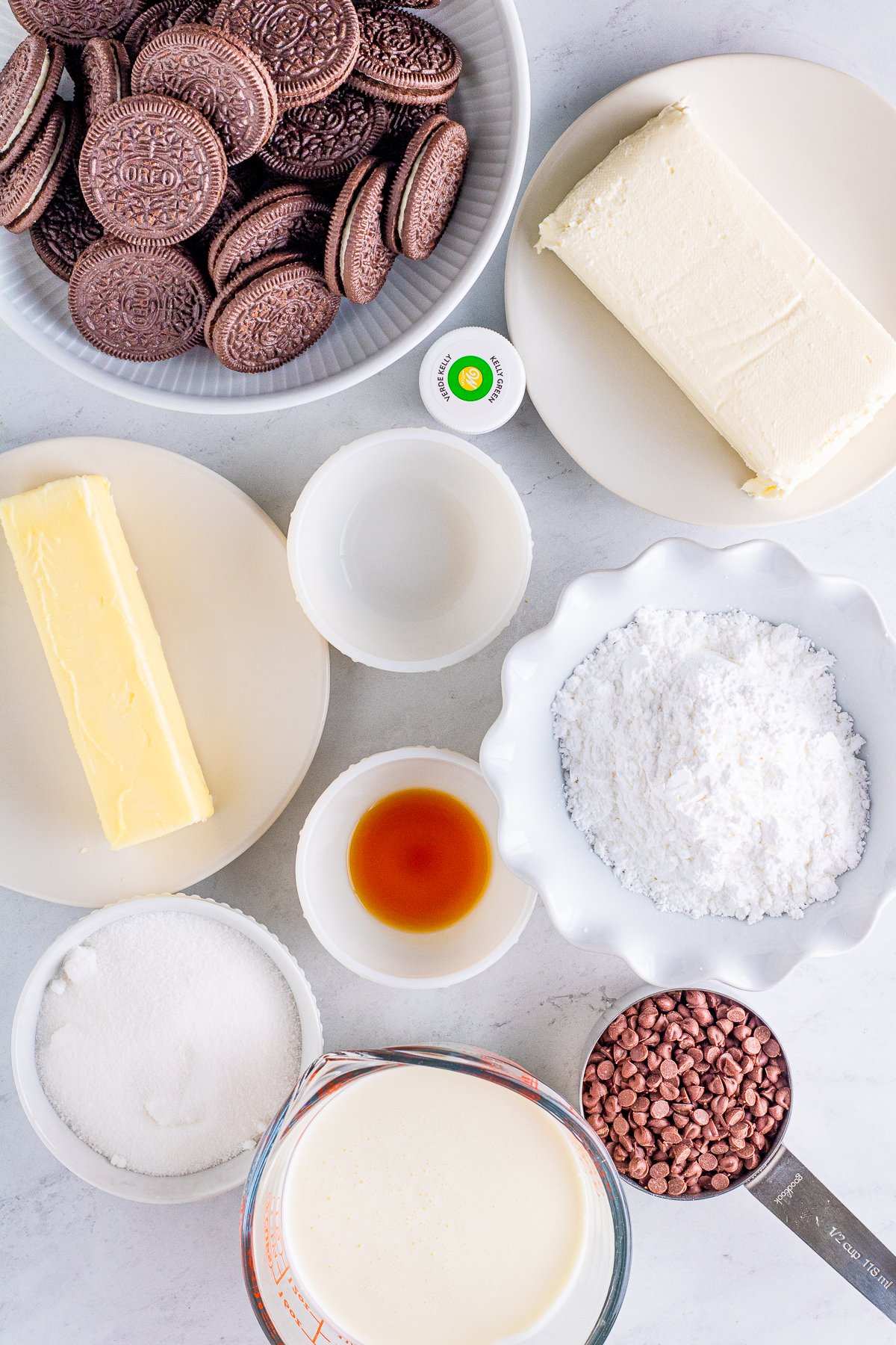 Ingredients needed to make a No Bake Mint Chocolate Chip Cheesecake.