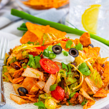 Doritos Taco Salad on plate with toppings.