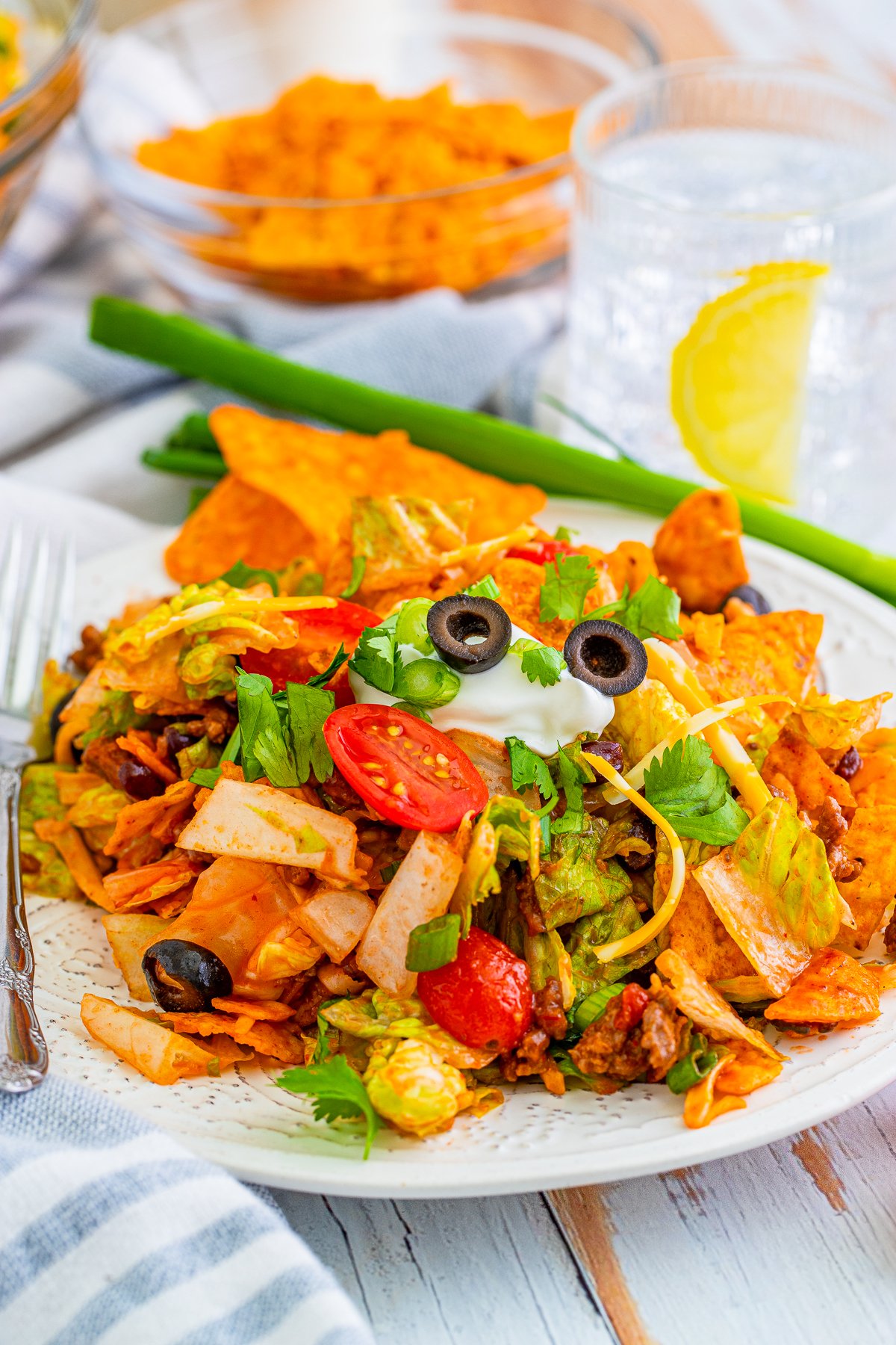 Doritos Taco Salad on plate with toppings.