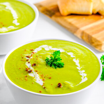 Garnished Pea Soup Recipe in white bowl.