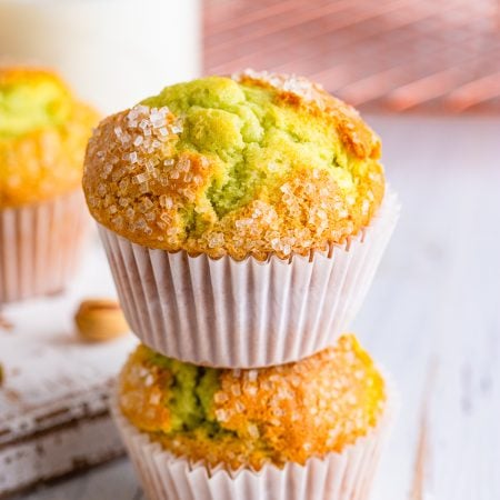 Two stacked Pistachio Muffins.