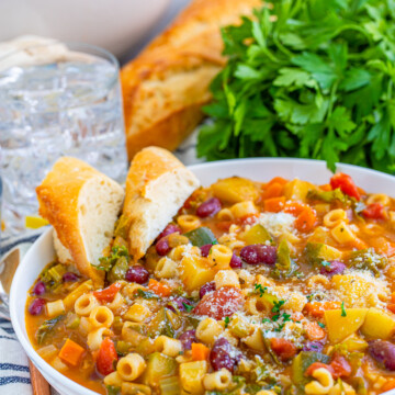 Bowl of soup with slices of bread in bowl.