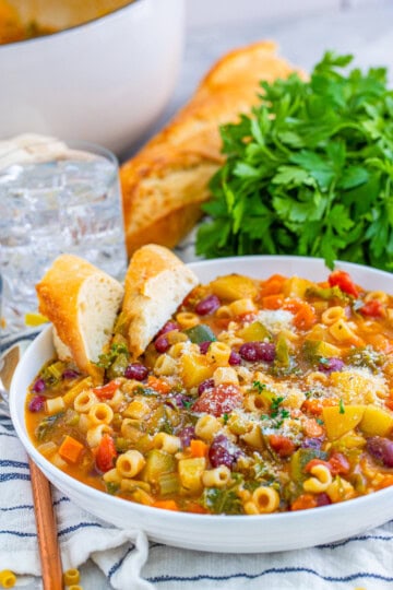 Bowl of soup with slices of bread in bowl.
