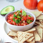 Pico De Gallo Recipe in bowl on plate with dippers.