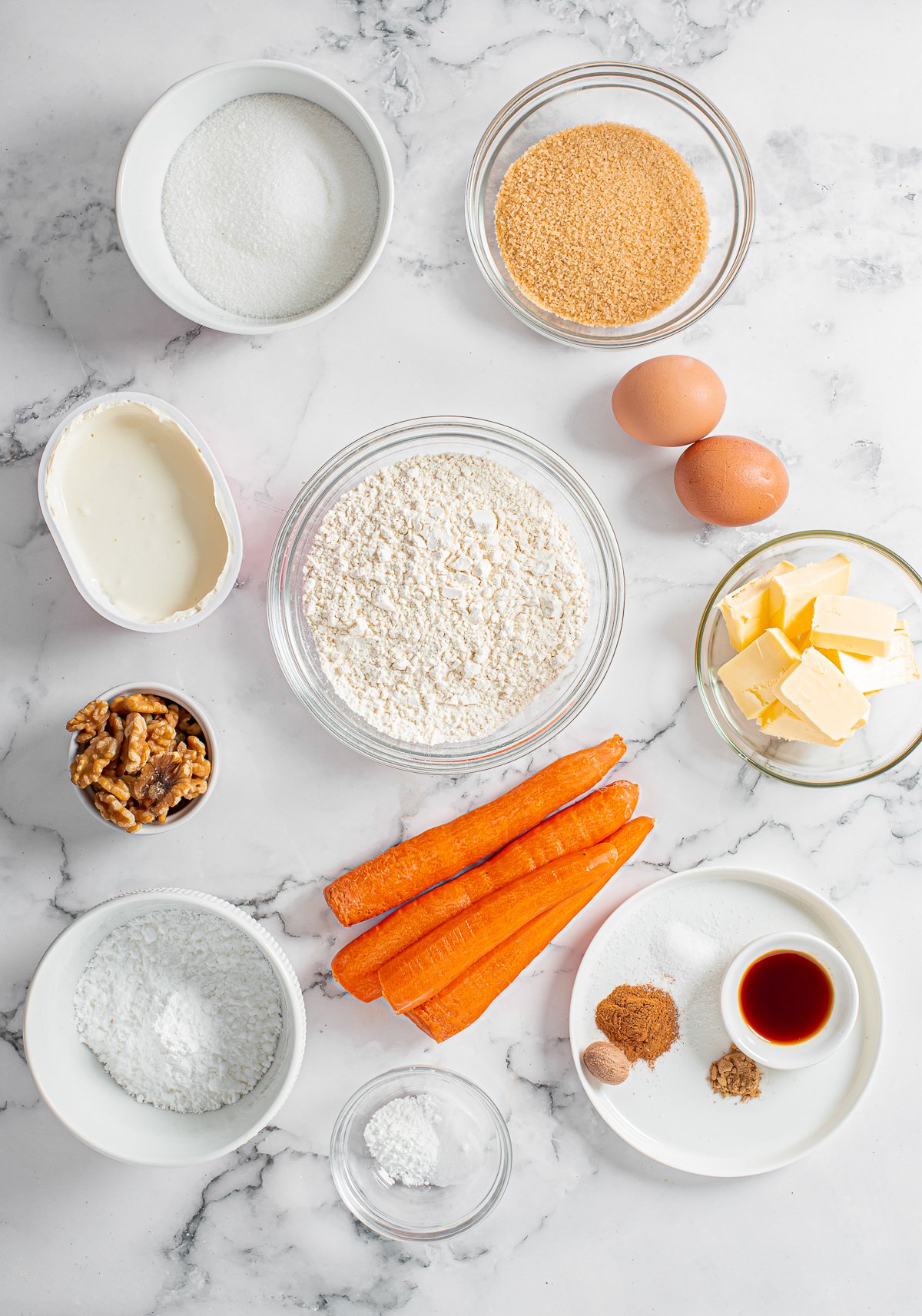 Ingredients needed to make a Carrot Loaf Cake.
