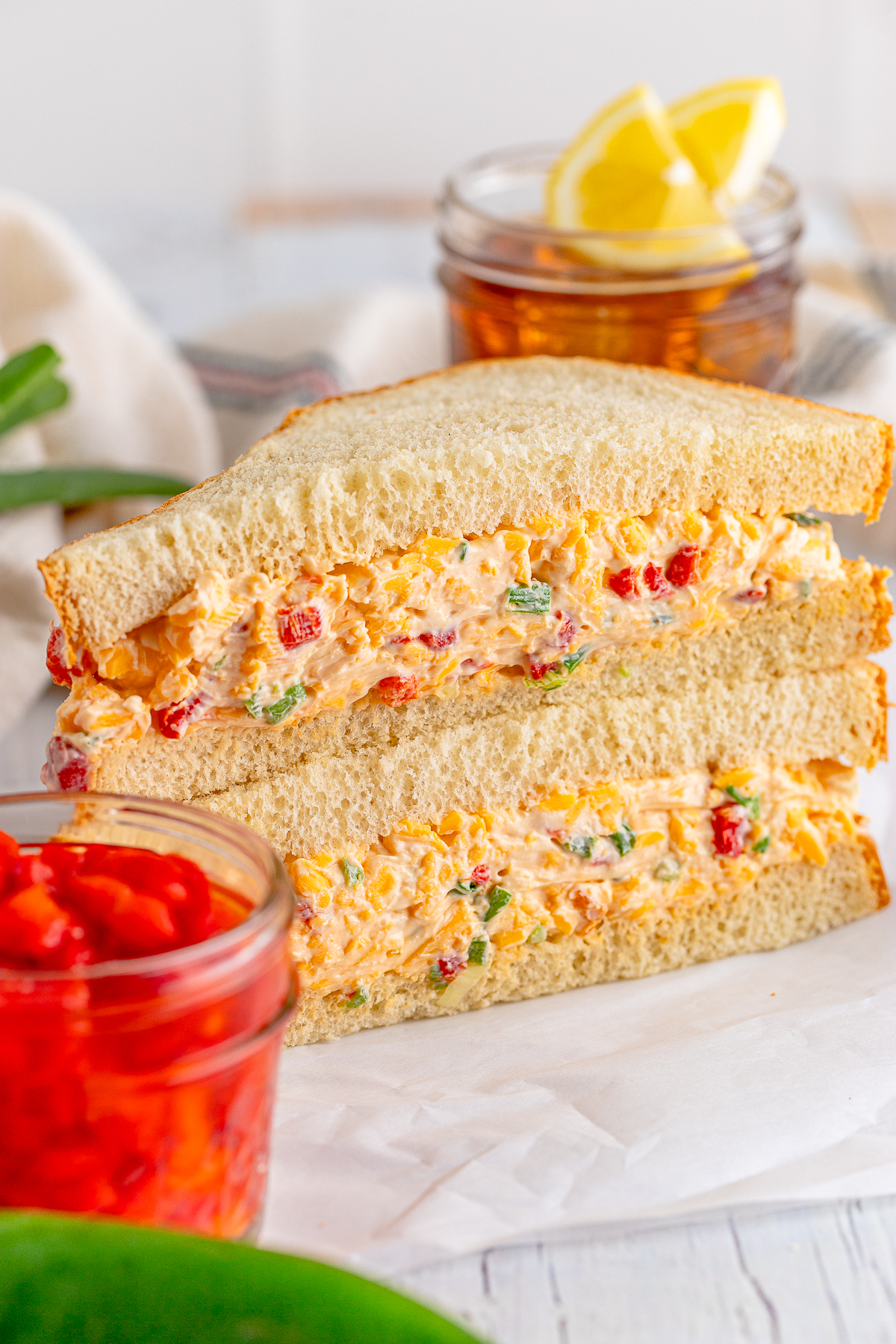 Sandwich with Pimento Cheese Recipe split in half showing filling.