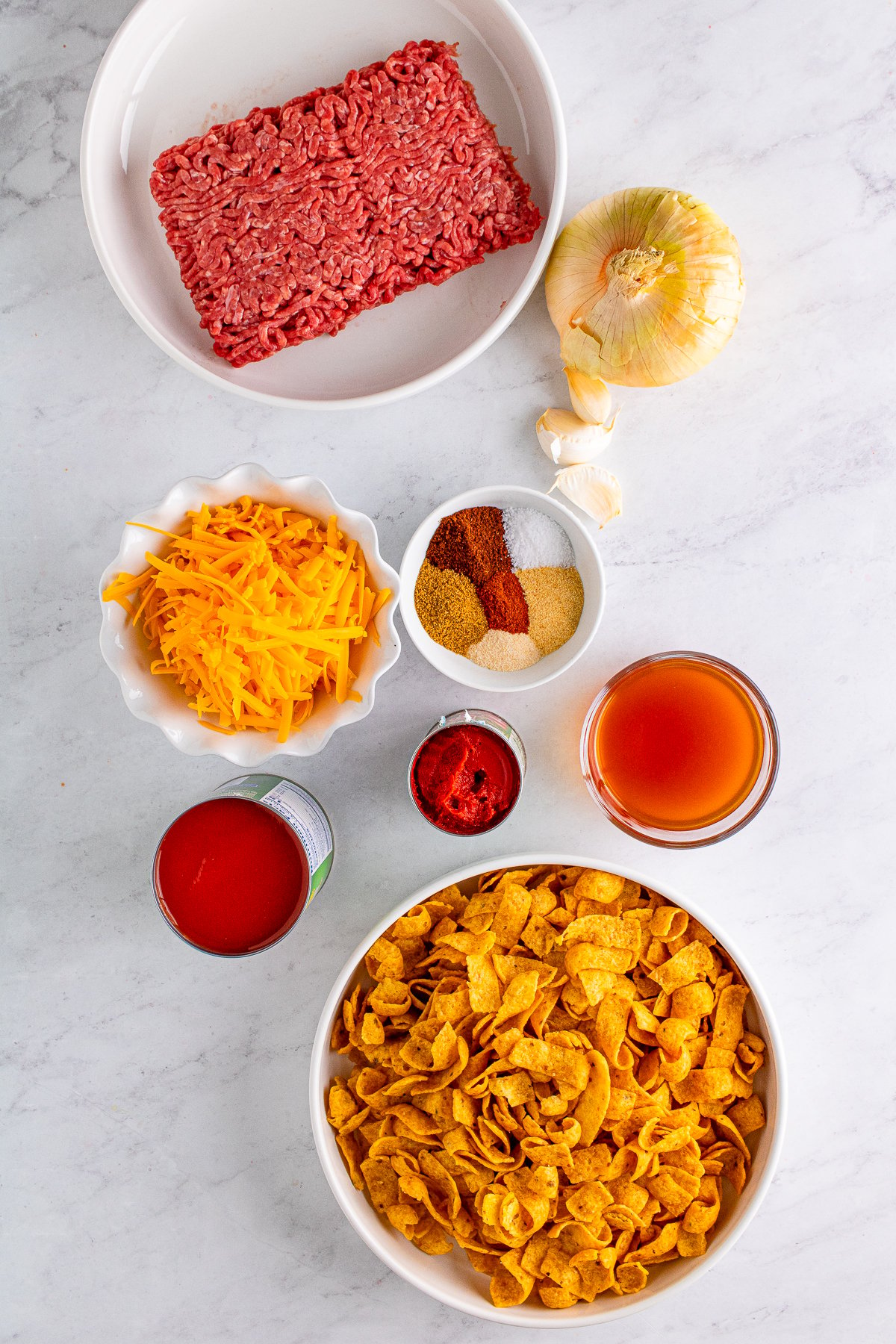 Ingredients needed to make a Frito Chili Pie Casserole.