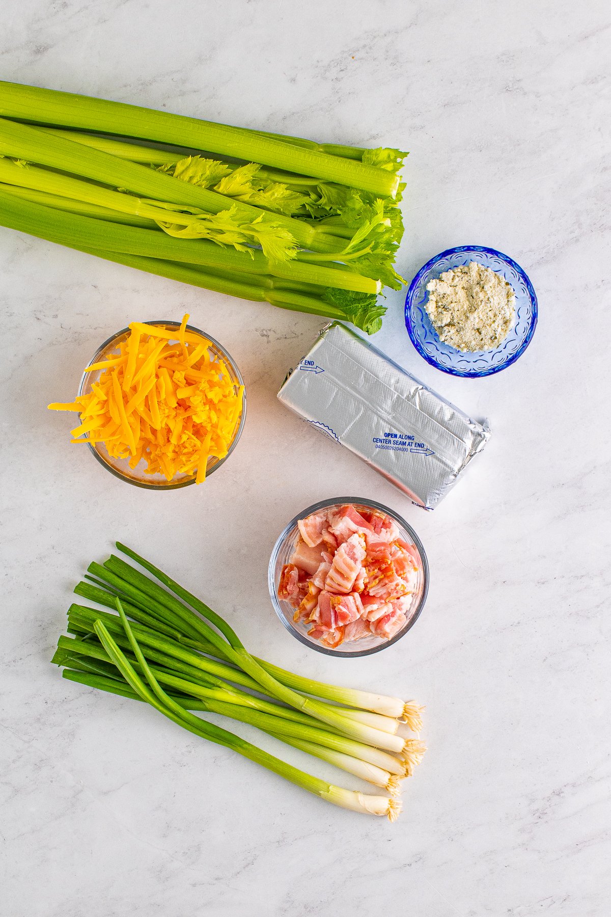 Ingredients needed to make Cheddar Bacon Ranch Stuffed Celery Sticks.