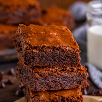 Three stacked Fudgy Brownies on top of one another.