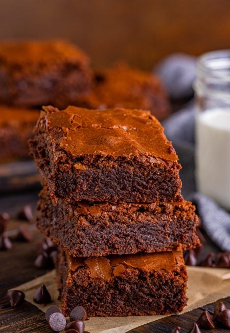 Three stacked Fudgy Brownies on top of one another.