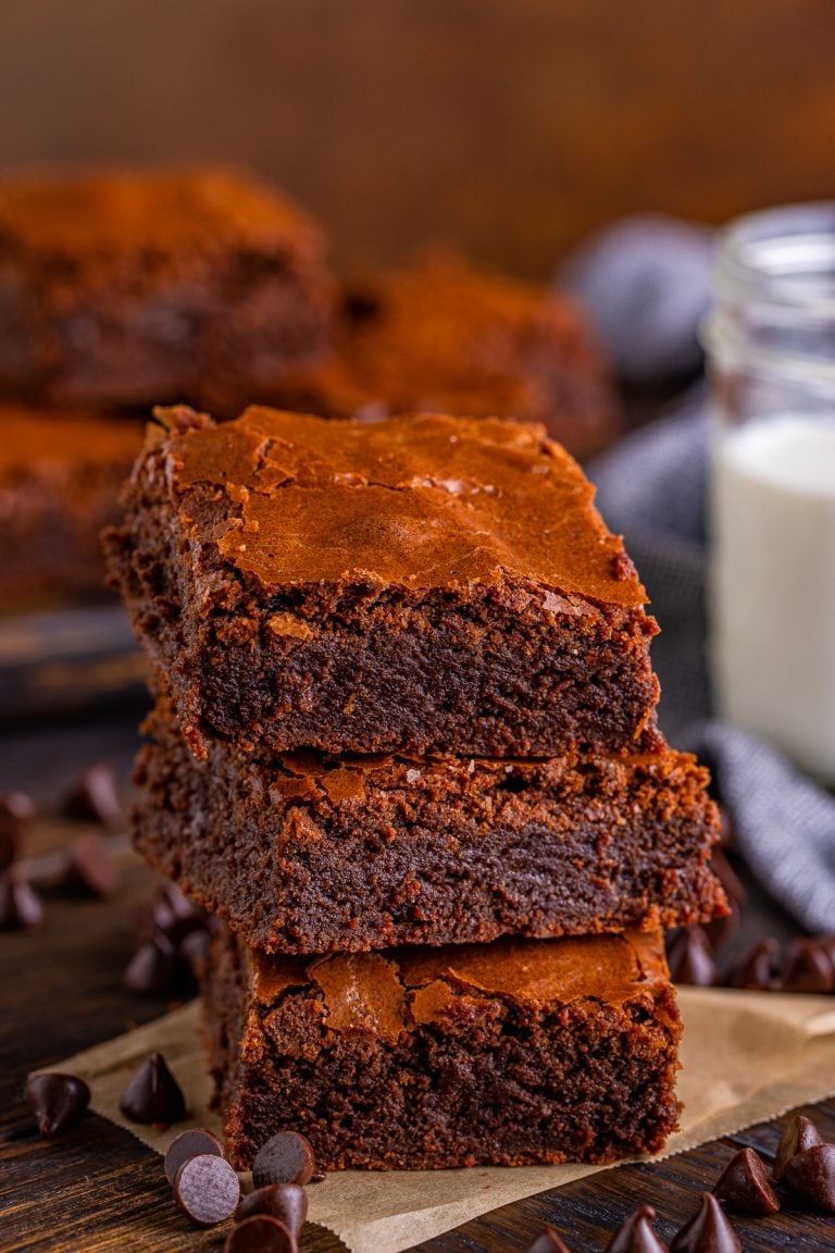 Three stacked Fudgy Brownies on top of one another.