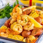 Shrimp Boil on tray with ingredients stacked on top of on another.