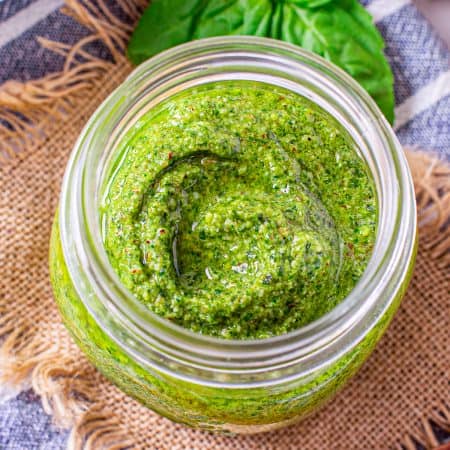 Overhead of Homemade Pesto in jar.