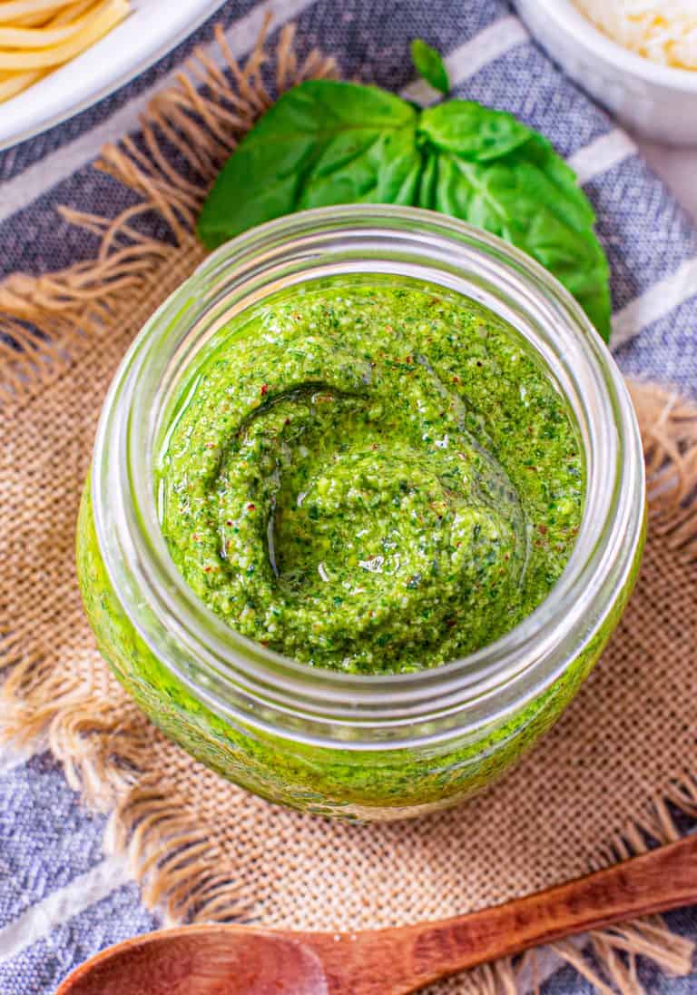 Overhead of Homemade Pesto in jar.