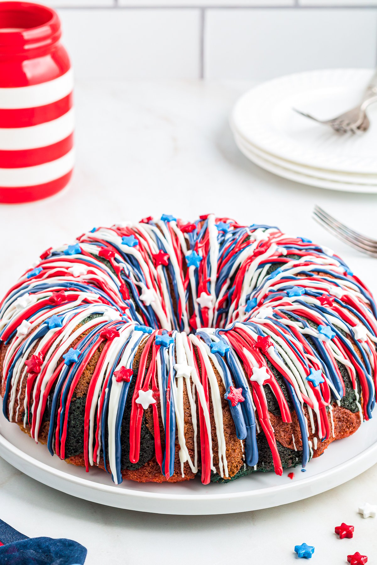 Finished Patriotic Bundt Cake decorated on cake plate.