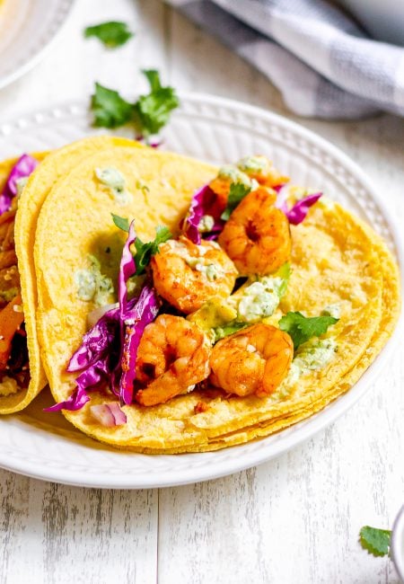 close up shot of plated spicy shrimp tacos