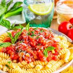 Tomato Basil Sauce served over pasta with basil garnish.