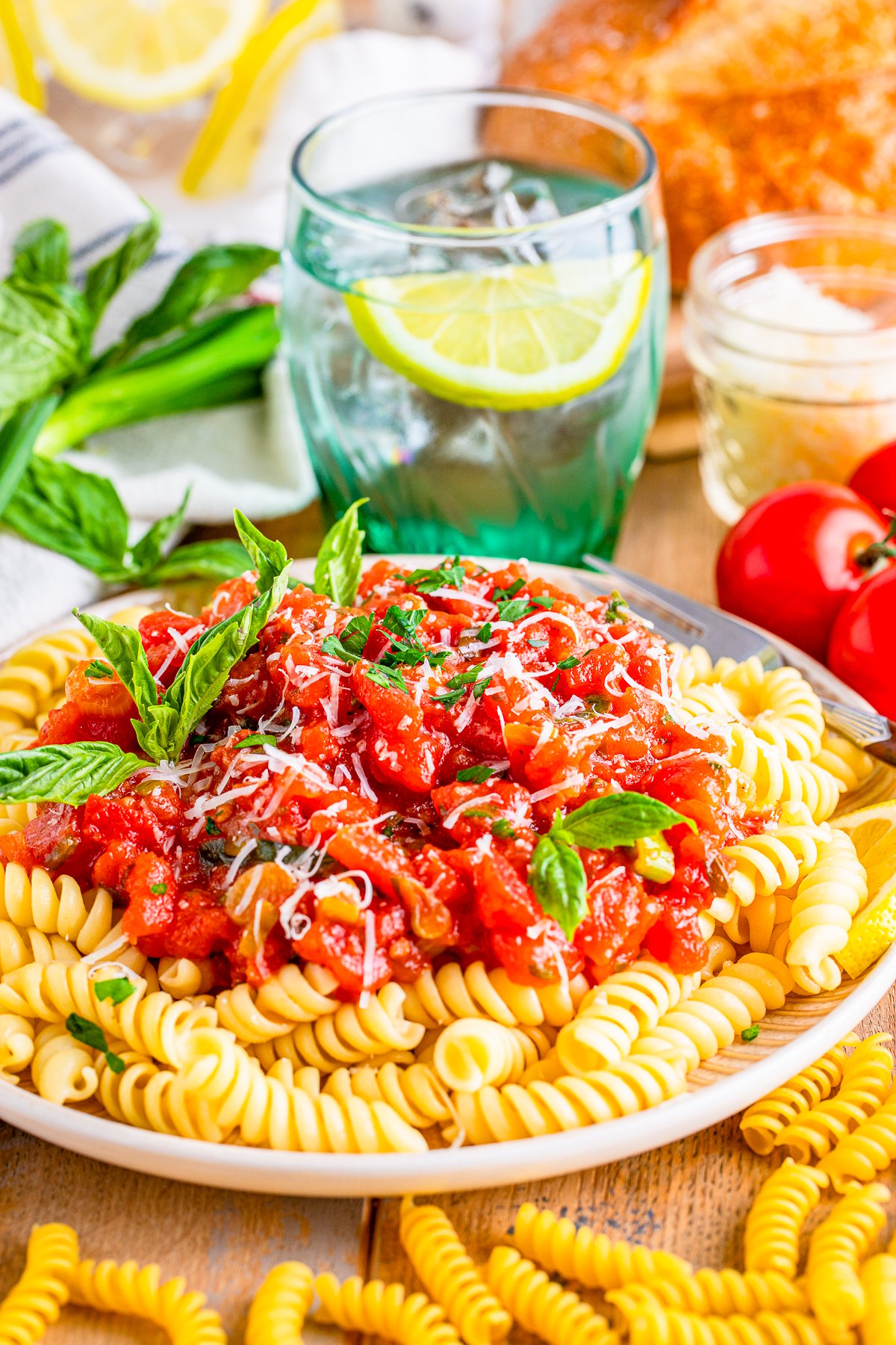 Tomato Basil Sauce served over pasta with basil garnish.