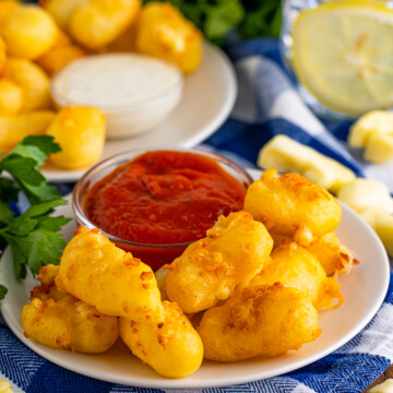 Fried Cheese Curds on plate with dipping sauce.