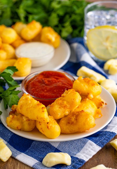 Fried Cheese Curds on plate with dipping sauce.