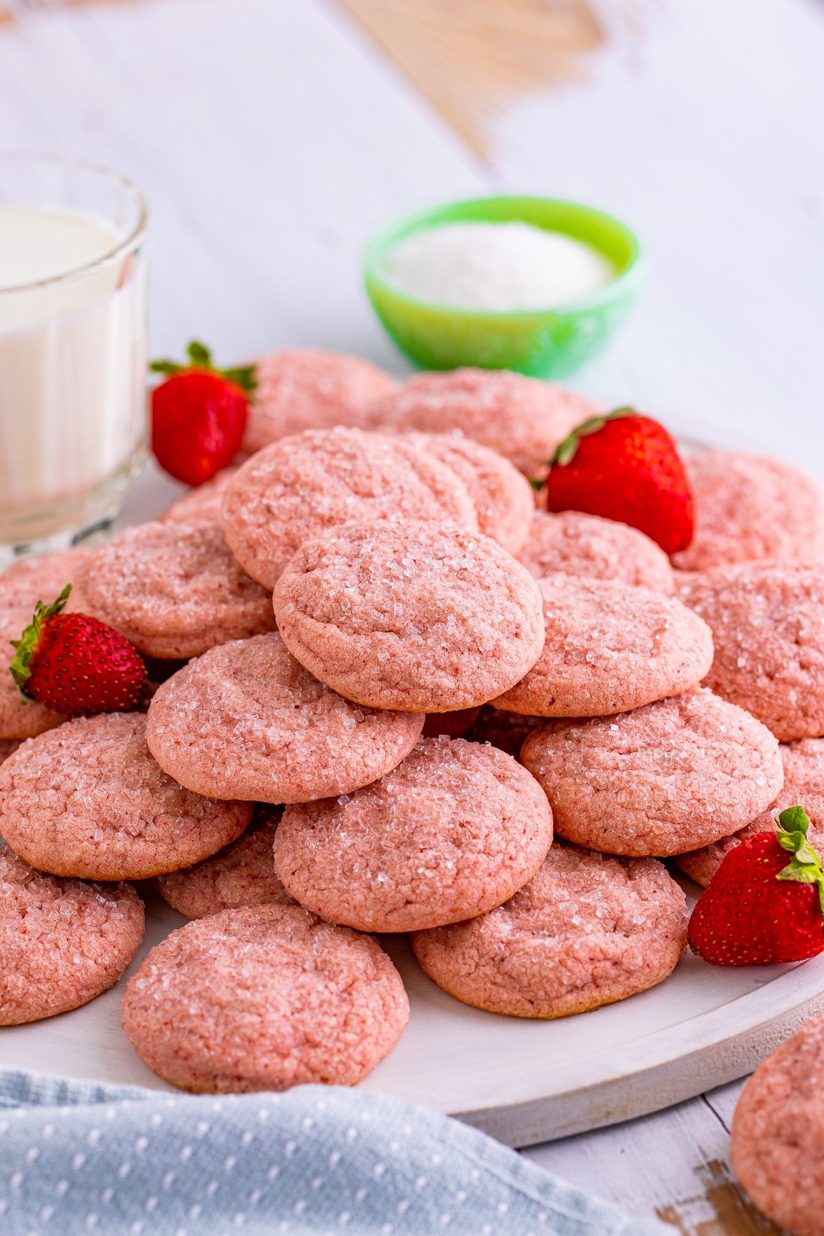 Strawberry Sugar Cookies stacked on white platter.